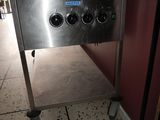 an image of a stainless steel oven with three burners on it