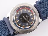 a watch with a blue strap on it on a white surface