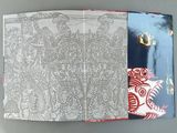 an open book with a picture of a cat on it