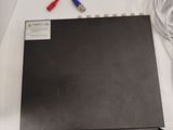 a black laptop computer sitting on top of a white table