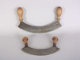 pair of antique wooden handles on a white background