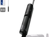 an image of a black and white vacuum cleaner with a cleaning kit
