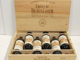 six bottles of wine in a wooden box on a table