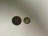 two coins sitting next to each other on a table