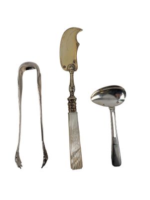three spoons, a knife, and a spoon on a white background