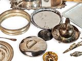 a lot of silver items that are on the table