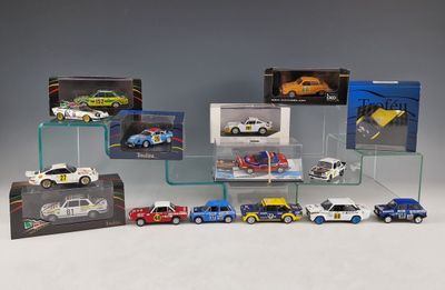 a lot of toy cars on display in a display case