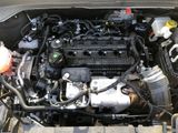a picture of a car engine in the trunk of a car