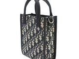 the small tote bag is decorated with a black and white pattern