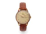 an old wrist watch with a brown leather strap on a white background
