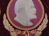 a red velvet jacket with a picture of a man on it