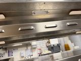 an image of a commercial kitchen with stainless steel cabinets