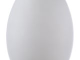 a large white egg shaped lamp on a white table