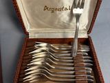 an image of a set of silverware in a case with a fork and knife