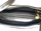 an image of a black purse with a gold zipper