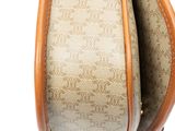 a close up of a purse with a handle on a white background