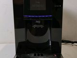 an image of a black coffee maker on a table