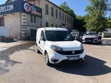a white van parked in front of a building