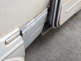 an image of a drain on the side of a bus