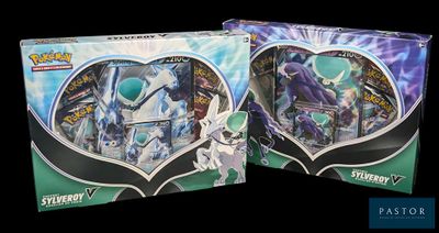 two boxes of pokemon trading cards are shown on a black background