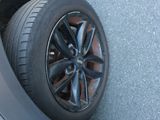 a tire that is sitting on the side of a car