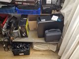 many different types of electronics on the floor in this room