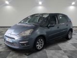 the grey citrole is parked on a checkered tile floor