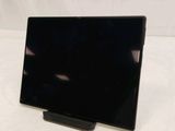an image of a black tablet computer on a stand