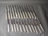 a lot of knives that are sitting on a table