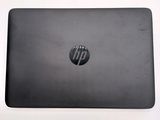the back of a laptop with a black hp logo on it