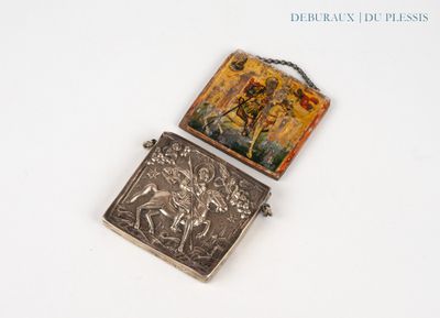 a small silver box with a picture of a man on it
