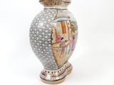 a vase that has a picture of a woman on it