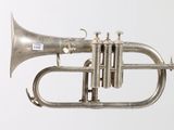 a silver trumpet that is hanging from the ceiling