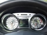 a close up of a car dashboard with various gauges