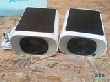 two speakers that are sitting on a table