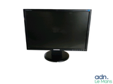 a computer monitor sitting on top of a desk