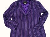 a close up of a purple striped jacket on a white background