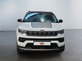 the front end of a white jeep parked in a room