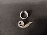an image of a silver ring and a silver ring with a bird on it