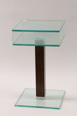 a close up of a glass table with a wooden base