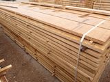 a large pile of lumber stacked on top of each other