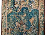 a blue and green tapestry with birds and flowers on it