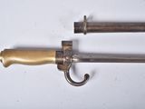 pair of antique brass - plated swords with wooden handles