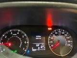 a close up of the dashboard of a car with the lights on