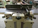 a man that is working on a machine in a factory