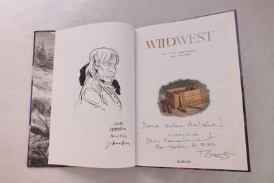 un livre sur lequel figure le dessin d'une femme tenant une boîte