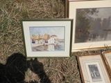 two framed pictures on the ground next to each other