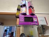 a stack of boxes on top of each other in a room