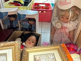 two dolls in a box and a doll in a box