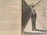an open book with a drawing of a man in a suit and tie